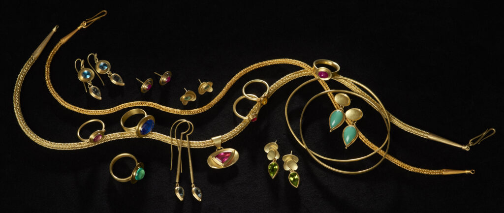 Selection of gold jewellery with coloured gemstones