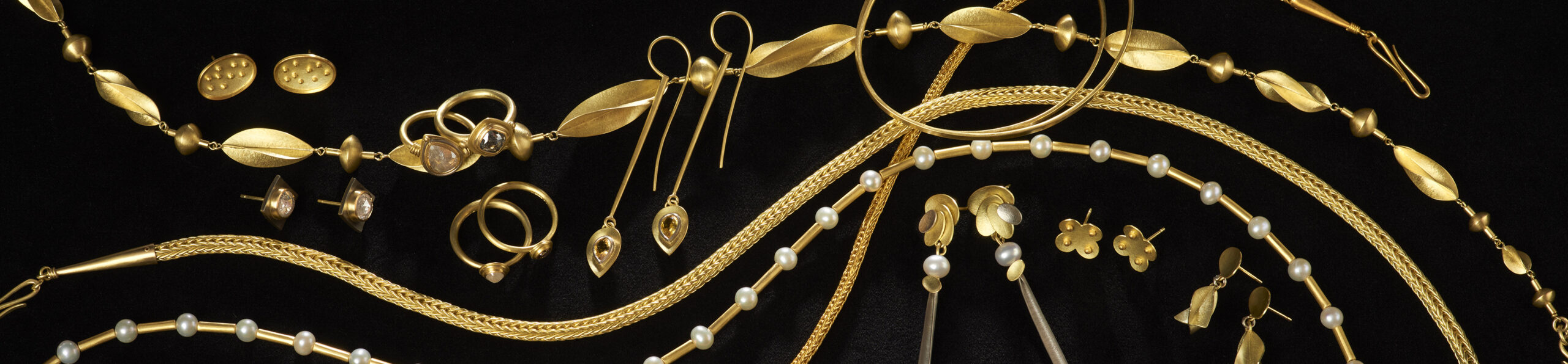 Selection of gold jewellery with diamonds and pearls